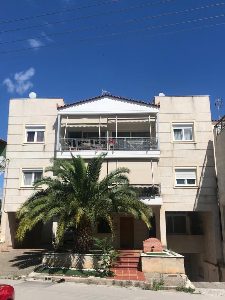 White apartment building with balconies in Marousi